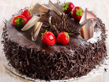 http://us.123rf.com/450wm/baibakova/baibakova1408/baibakova140800310/31176896-sweet-chocolate-cake-with-strawberries-selective-focus.jpg?ver=6
