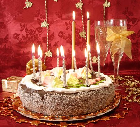 http://us.123rf.com/450wm/InvisibleV/InvisibleV0702/InvisibleV070200060/763809-celebratory-table-cake-and-candles-two-glasses-with-champagne-gift-boxes-on-red.jpg?ver=6