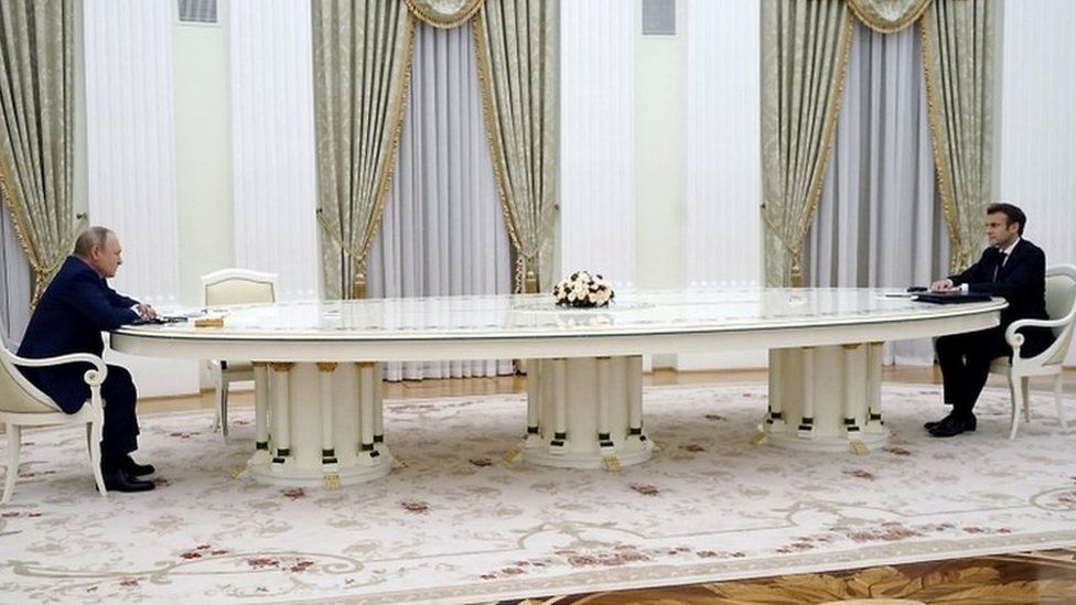 Putin left and Macron right meet in Moscow