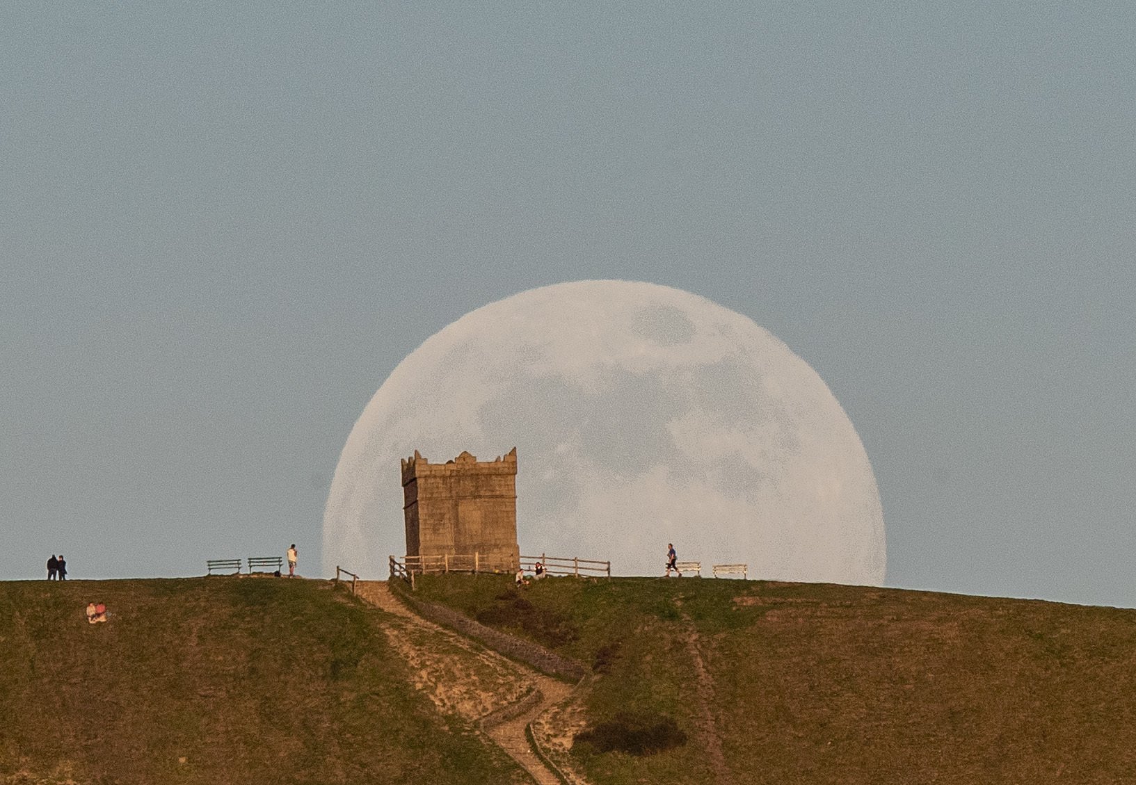 The moon rises over Rivington Pike Bolton Lancashire Credits PA